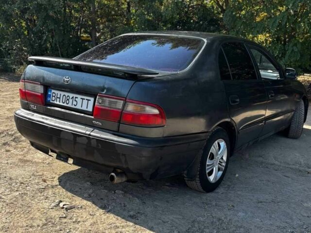 Черный Тойота Carina E, объемом двигателя 1.6 л и пробегом 450 тыс. км за 850 $, фото 1 на Automoto.ua