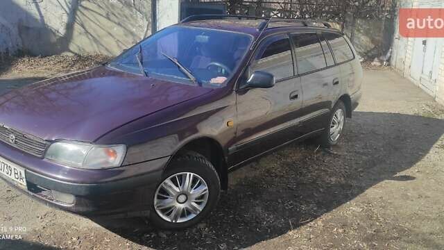 Фиолетовый Тойота Carina E, объемом двигателя 1.6 л и пробегом 400 тыс. км за 3000 $, фото 1 на Automoto.ua