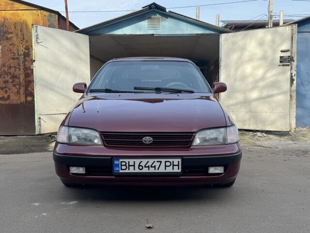 Красный Тойота Carina E, объемом двигателя 1.6 л и пробегом 259 тыс. км за 2800 $, фото 1 на Automoto.ua