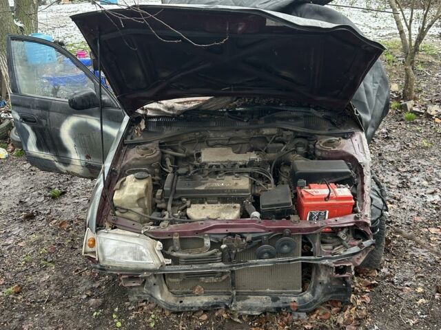 Червоний Тойота Carina E, об'ємом двигуна 1.6 л та пробігом 435 тис. км за 828 $, фото 1 на Automoto.ua