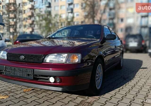 Червоний Тойота Carina E, об'ємом двигуна 2 л та пробігом 260 тис. км за 4500 $, фото 1 на Automoto.ua