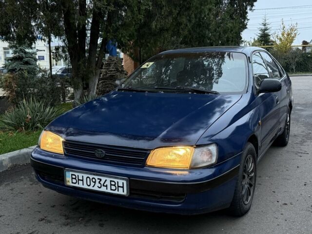 Синий Тойота Carina E, объемом двигателя 2 л и пробегом 290 тыс. км за 1500 $, фото 1 на Automoto.ua