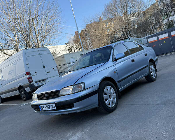 Синій Тойота Carina E, об'ємом двигуна 1.76 л та пробігом 250 тис. км за 2499 $, фото 1 на Automoto.ua