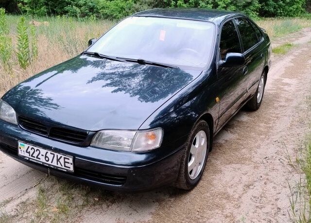 Тойота Carina E 1993 у Чернівцях на Automoto.ua Зелений Тойота Carina E, об'ємом двигуна 2 л та пробігом 290 тис. км за 2400 $, фото 1 на Automoto.ua