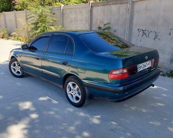 Зеленый Тойота Carina E, объемом двигателя 1.6 л и пробегом 470 тыс. км за 3100 $, фото 1 на Automoto.ua