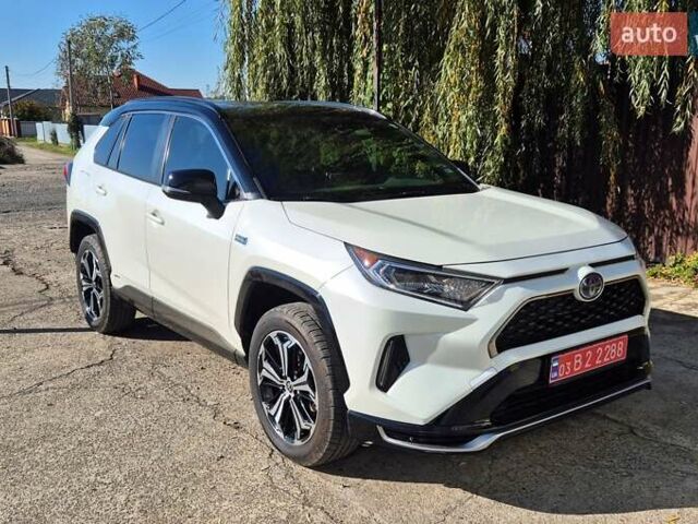 Белый Тойота RAV4 PHEV, объемом двигателя 2.49 л и пробегом 90 тыс. км за 42000 $, фото 1 на Automoto.ua