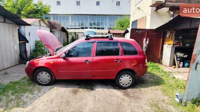 Красный ВАЗ 1117 Калина, объемом двигателя 1.39 л и пробегом 184 тыс. км за 2050 $, фото 1 на Automoto.ua