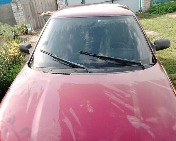 Красный ВАЗ 2112, объемом двигателя 1.6 л и пробегом 195 тыс. км за 1188 $, фото 1 на Automoto.ua