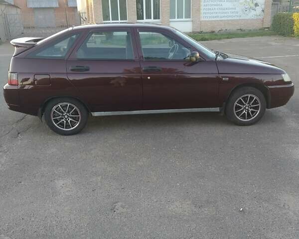 Красный ВАЗ 2112, объемом двигателя 1.6 л и пробегом 174 тыс. км за 2400 $, фото 1 на Automoto.ua