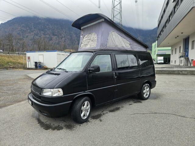 Черный Фольксваген Мультиван, объемом двигателя 2.5 л и пробегом 325 тыс. км за 13838 $, фото 1 на Automoto.ua