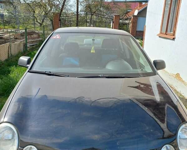 Черный Фольксваген Поло, объемом двигателя 1.4 л и пробегом 125 тыс. км за 5650 $, фото 1 на Automoto.ua