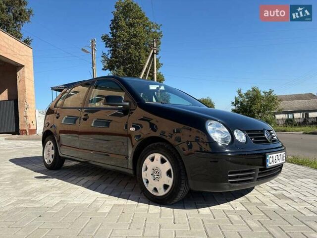 Черный Фольксваген Поло, объемом двигателя 1.4 л и пробегом 145 тыс. км за 5499 $, фото 1 на Automoto.ua