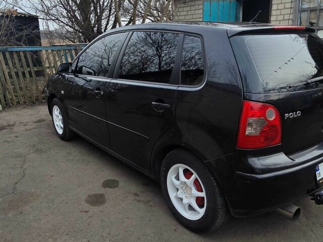 Черный Фольксваген Поло, объемом двигателя 1.2 л и пробегом 240 тыс. км за 2000 $, фото 1 на Automoto.ua
