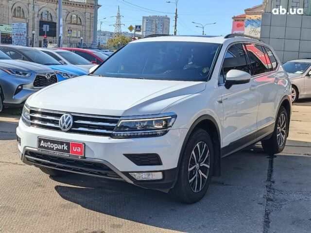 Білий Фольксваген Тігуан, об'ємом двигуна 2 л та пробігом 128 тис. км за 19990 $, фото 1 на Automoto.ua