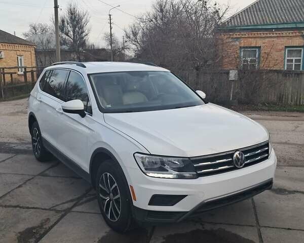 Білий Фольксваген Тігуан, об'ємом двигуна 2 л та пробігом 142 тис. км за 17200 $, фото 1 на Automoto.ua