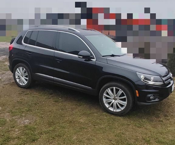 Черный Фольксваген Тигуан, объемом двигателя 2 л и пробегом 278 тыс. км за 12000 $, фото 1 на Automoto.ua