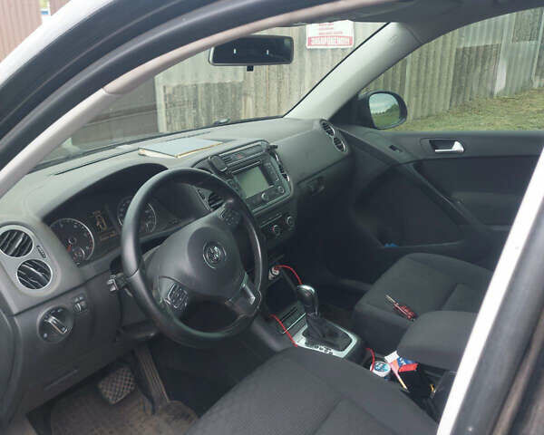 Чорний Фольксваген Тігуан, об'ємом двигуна 2 л та пробігом 340 тис. км за 14500 $, фото 1 на Automoto.ua