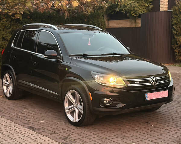 Чорний Фольксваген Тігуан, об'ємом двигуна 2 л та пробігом 207 тис. км за 14200 $, фото 1 на Automoto.ua