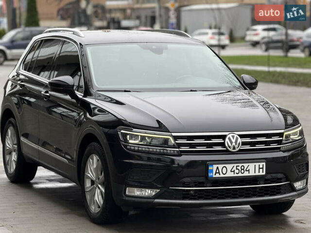 Черный Фольксваген Тигуан, объемом двигателя 2 л и пробегом 209 тыс. км за 23800 $, фото 1 на Automoto.ua