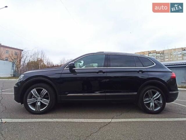 Черный Фольксваген Тигуан, объемом двигателя 2 л и пробегом 107 тыс. км за 21800 $, фото 1 на Automoto.ua