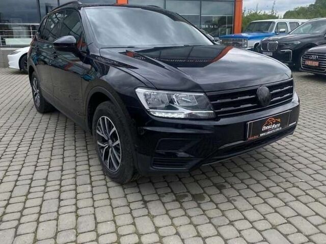 Чорний Фольксваген Тігуан, об'ємом двигуна 2 л та пробігом 131 тис. км за 18500 $, фото 1 на Automoto.ua