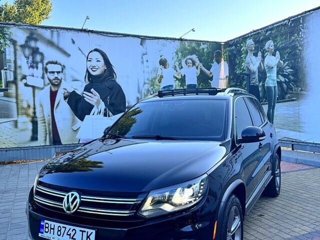 Черный Фольксваген Тигуан, объемом двигателя 2 л и пробегом 124 тыс. км за 16000 $, фото 1 на Automoto.ua