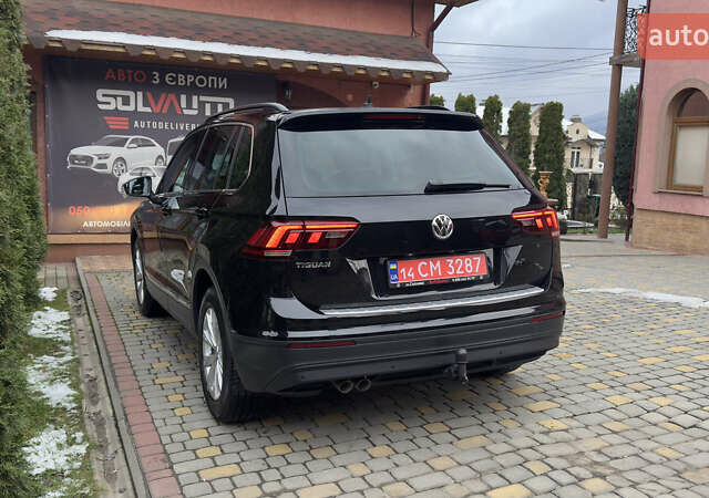 Чорний Фольксваген Тігуан, об'ємом двигуна 1.98 л та пробігом 258 тис. км за 23300 $, фото 1 на Automoto.ua