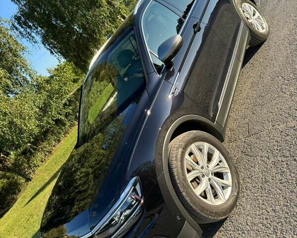 Чорний Фольксваген Тігуан, об'ємом двигуна 2 л та пробігом 223 тис. км за 27799 $, фото 1 на Automoto.ua