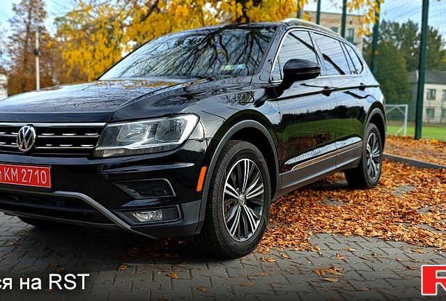 Черный Фольксваген Тигуан, объемом двигателя 2 л и пробегом 314 тыс. км за 15200 $, фото 1 на Automoto.ua