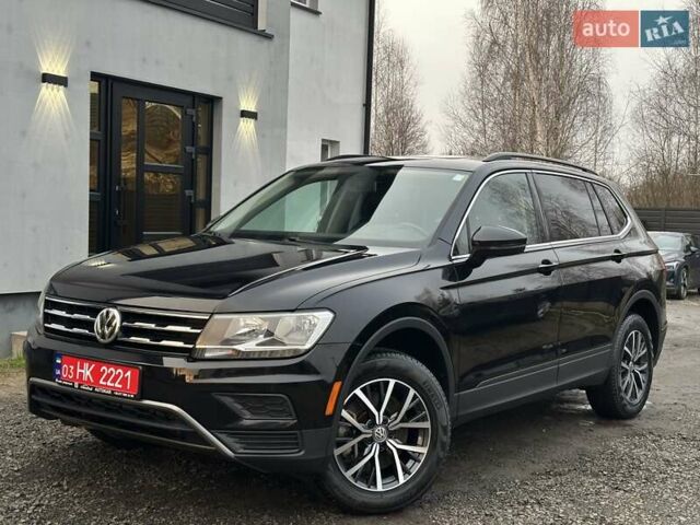 Чорний Фольксваген Тігуан, об'ємом двигуна 2 л та пробігом 200 тис. км за 15900 $, фото 1 на Automoto.ua