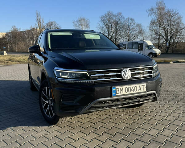 Черный Фольксваген Тигуан, объемом двигателя 2 л и пробегом 160 тыс. км за 21000 $, фото 1 на Automoto.ua