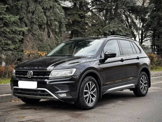 Чорний Фольксваген Тігуан, об'ємом двигуна 2 л та пробігом 134 тис. км за 22000 $, фото 1 на Automoto.ua