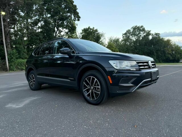 Чорний Фольксваген Тігуан, об'ємом двигуна 2 л та пробігом 11 тис. км за 6300 $, фото 1 на Automoto.ua