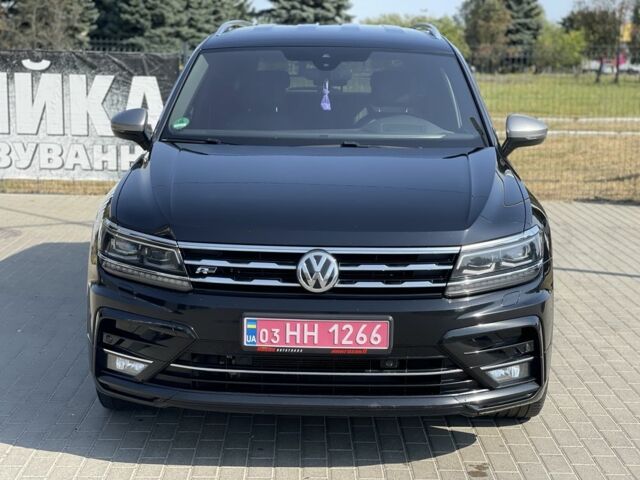 Чорний Фольксваген Тігуан, об'ємом двигуна 2 л та пробігом 300 тис. км за 28500 $, фото 1 на Automoto.ua