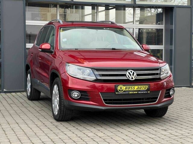 Червоний Фольксваген Тігуан, об'ємом двигуна 2 л та пробігом 120 тис. км за 11800 $, фото 1 на Automoto.ua