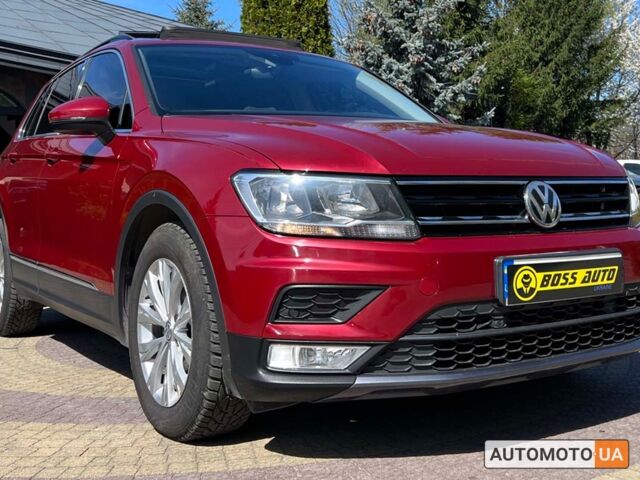 Красный Фольксваген Тигуан, объемом двигателя 2 л и пробегом 225 тыс. км за 18700 $, фото 1 на Automoto.ua