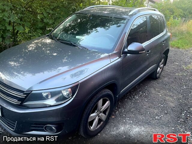 Серый Фольксваген Тигуан, объемом двигателя 2 л и пробегом 159 тыс. км за 16000 $, фото 1 на Automoto.ua