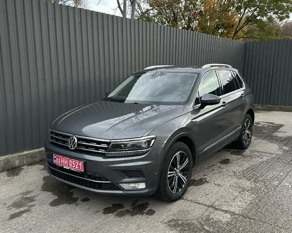 Сірий Фольксваген Тігуан, об'ємом двигуна 2 л та пробігом 256 тис. км за 24300 $, фото 1 на Automoto.ua