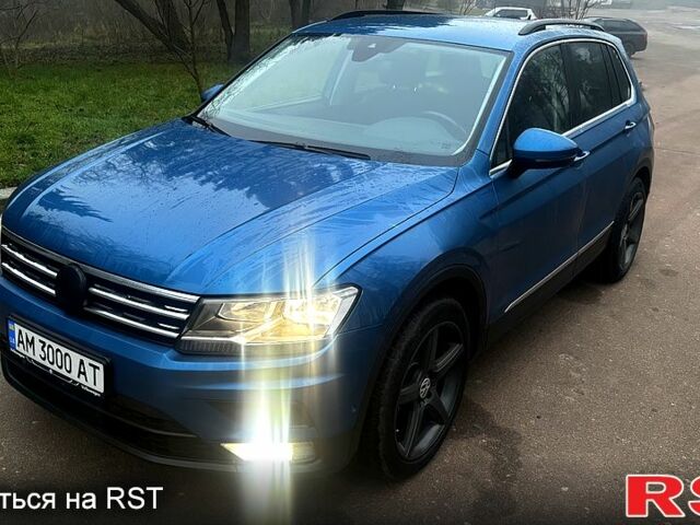 Синий Фольксваген Тигуан, объемом двигателя 2 л и пробегом 153 тыс. км за 23999 $, фото 1 на Automoto.ua