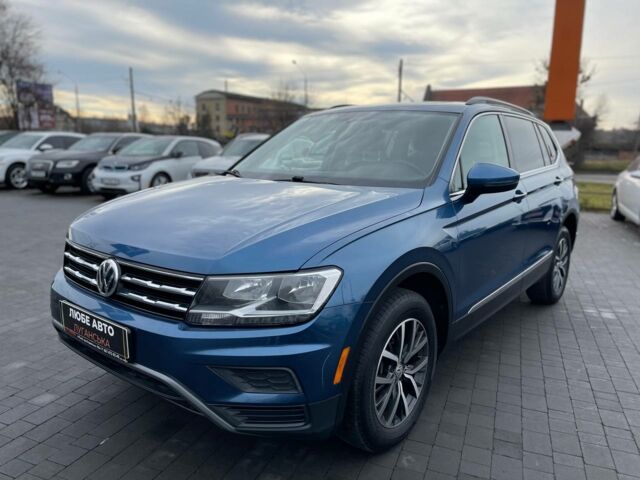 Синий Фольксваген Тигуан, объемом двигателя 2 л и пробегом 233 тыс. км за 16300 $, фото 1 на Automoto.ua