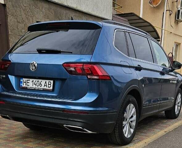 Синий Фольксваген Тигуан, объемом двигателя 2 л и пробегом 153 тыс. км за 19350 $, фото 1 на Automoto.ua