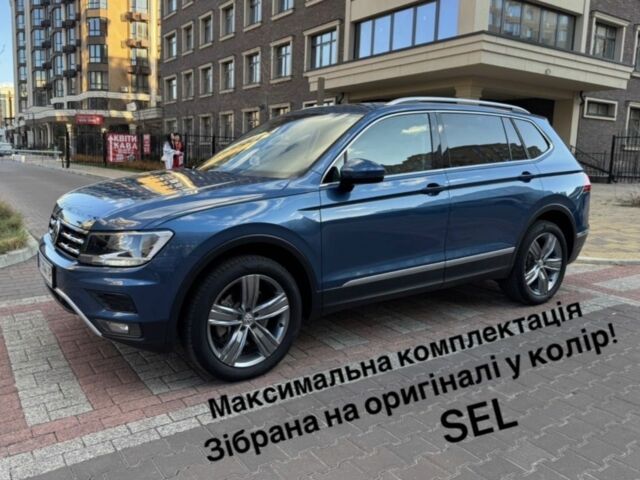Синий Фольксваген Тигуан, объемом двигателя 2 л и пробегом 124 тыс. км за 23500 $, фото 1 на Automoto.ua