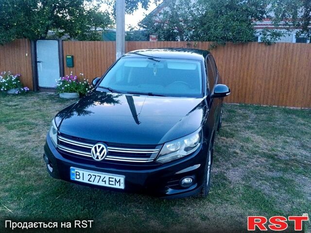 Зелений Фольксваген Тігуан, об'ємом двигуна 2 л та пробігом 280 тис. км за 13700 $, фото 1 на Automoto.ua