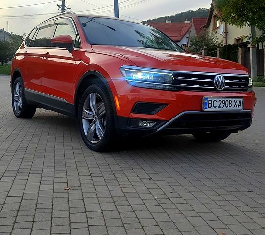 Помаранчевий Фольксваген Тігуан, об'ємом двигуна 2 л та пробігом 100 тис. км за 24500 $, фото 1 на Automoto.ua