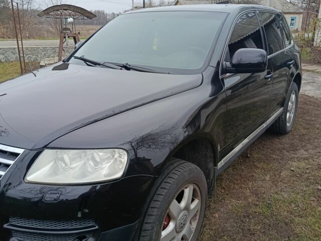 Черный Фольксваген Туарег, объемом двигателя 3.2 л и пробегом 320 тыс. км за 7800 $, фото 1 на Automoto.ua