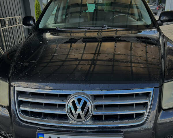 Черный Фольксваген Туарег, объемом двигателя 2.46 л и пробегом 400 тыс. км за 7000 $, фото 1 на Automoto.ua