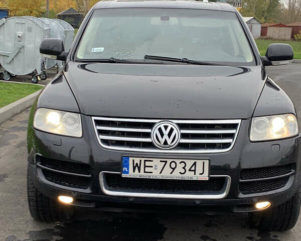 Черный Фольксваген Туарег, объемом двигателя 4.9 л и пробегом 230 тыс. км за 5800 $, фото 1 на Automoto.ua
