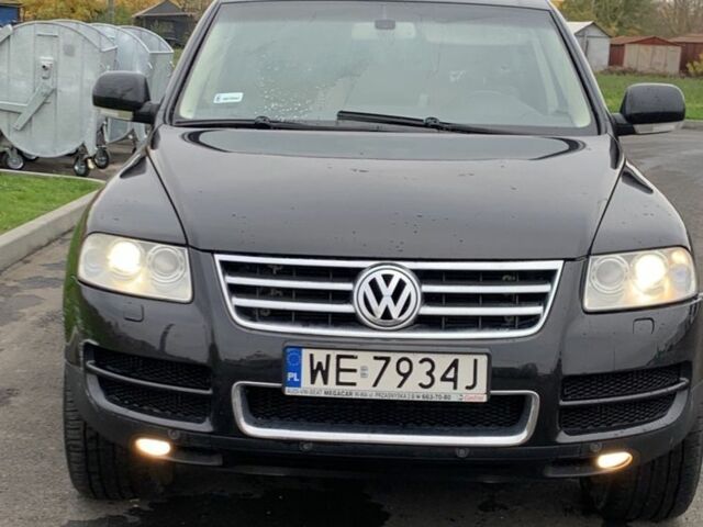 Черный Фольксваген Туарег, объемом двигателя 5 л и пробегом 230 тыс. км за 5800 $, фото 1 на Automoto.ua