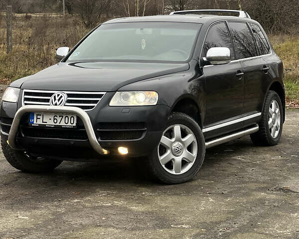 Черный Фольксваген Туарег, объемом двигателя 3 л и пробегом 325 тыс. км за 5900 $, фото 1 на Automoto.ua