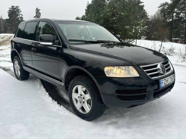 Черный Фольксваген Туарег, объемом двигателя 3 л и пробегом 295 тыс. км за 3636 $, фото 1 на Automoto.ua